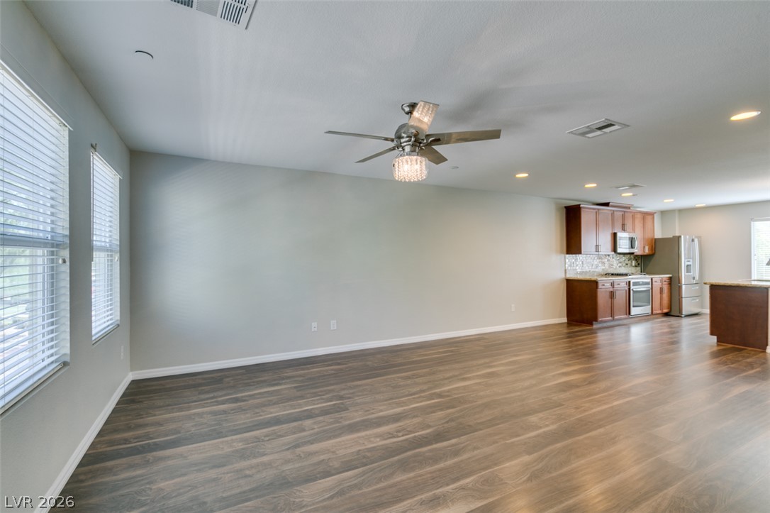 4650 Ranch House Road, Unit 46 North Las Vegas, NV 89031 - Photo 14 of 38 An open layout connects the spacious living area to the modern kitchen.
