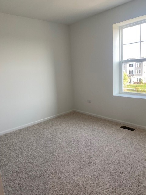 4515 Chelsea Mnr Circle, Unit 4515 Aurora, IL 60504 - Photo 26 of 37 an empty room with a window