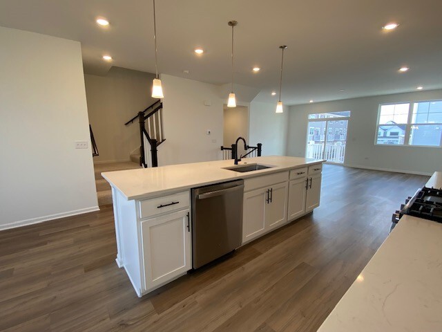 4515 Chelsea Mnr Circle, Unit 4515 Aurora, IL 60504 - Photo 10 of 37 a view of a room with wooden floor and staircase