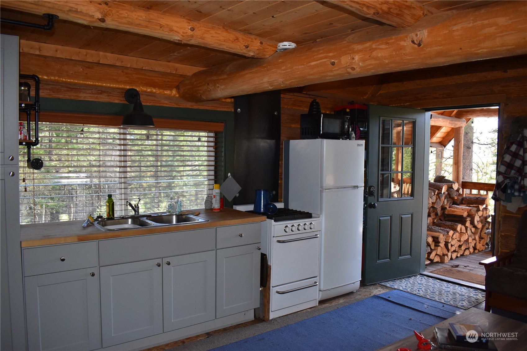 100 Lone Pine Trail Riverside, WA 98849 - Photo 15 of 37 a kitchen with refrigerator and window