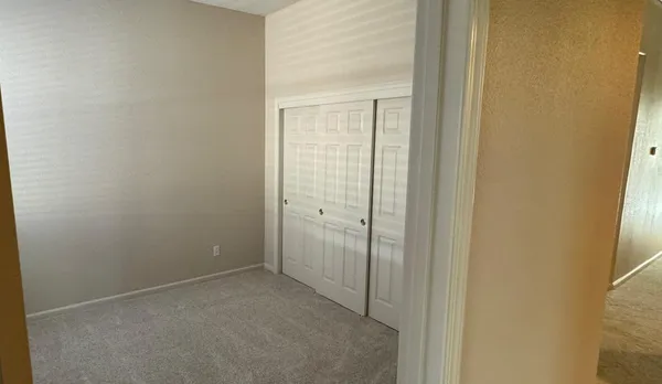 a view of empty room with windows