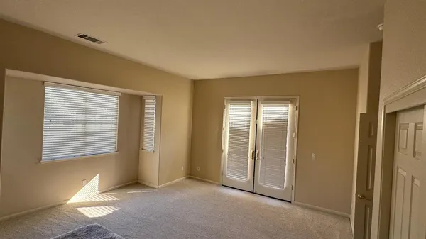 a room with washing machine and window