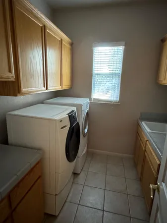 a bathroom with a sink toilet and a mirror