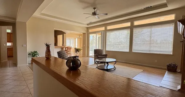 a living room with furniture and a large window