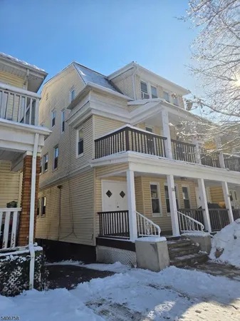 a kitchen with a refrigerator sink and cabinets
