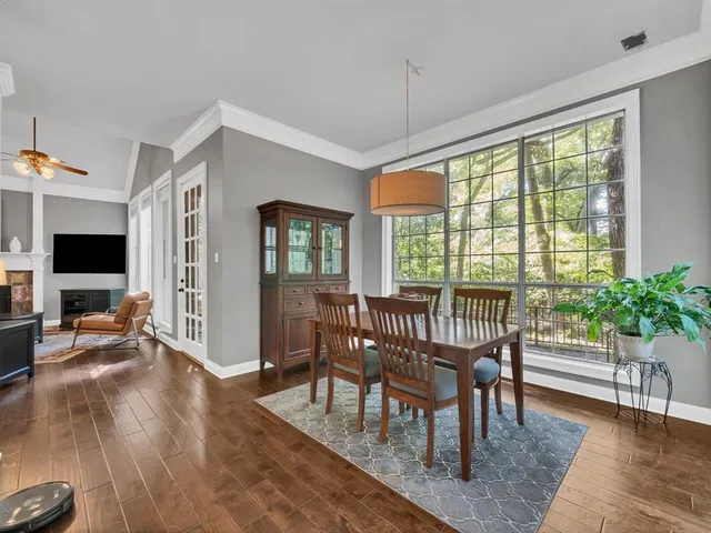 a view of a livingroom with furniture window and wooden floor