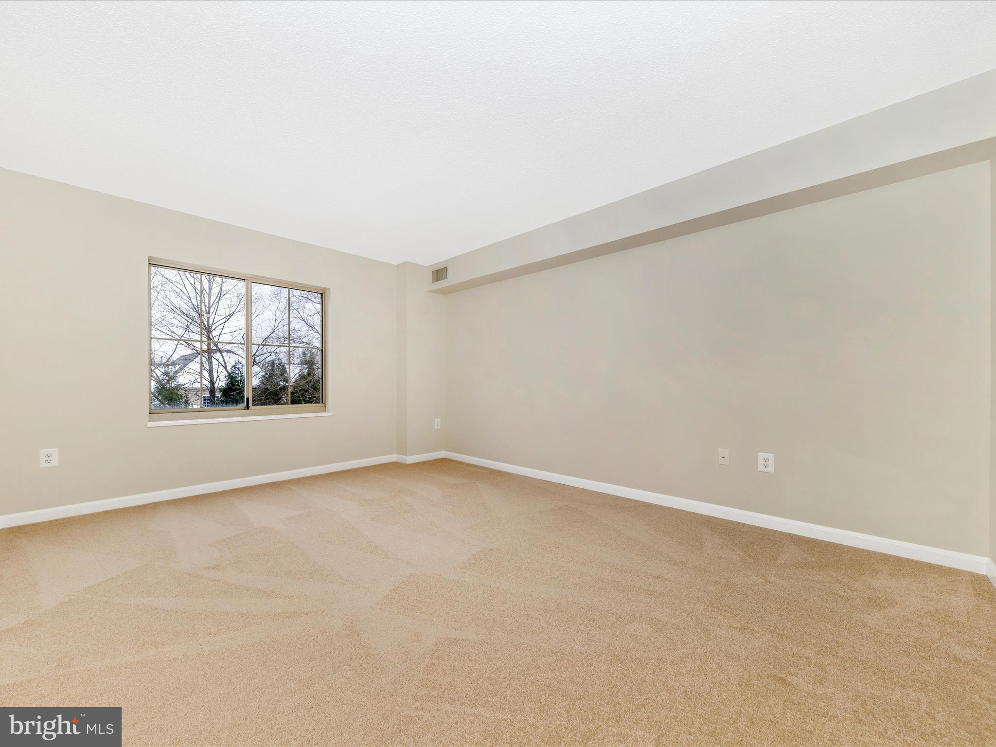 14809 Pennfield Circle, Unit 402 Silver Spring, MD 20906 - Photo 12 of 59 an empty room with windows