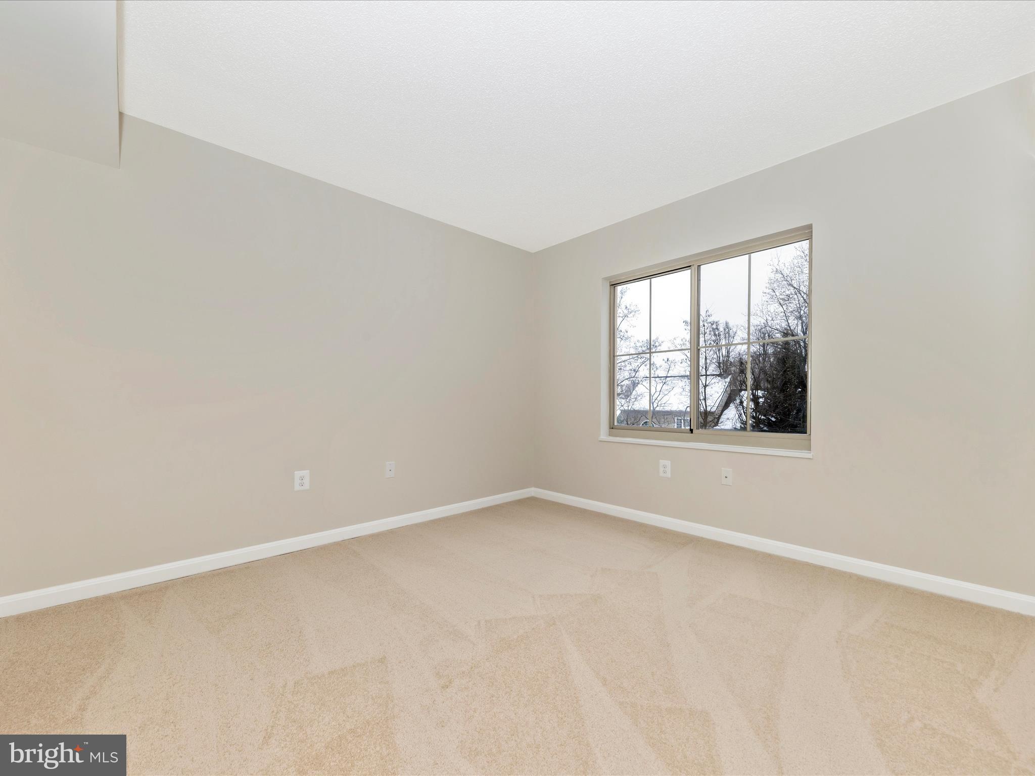 14809 Pennfield Circle, Unit 402 Silver Spring, MD 20906 - Photo 17 of 59 an empty room with windows