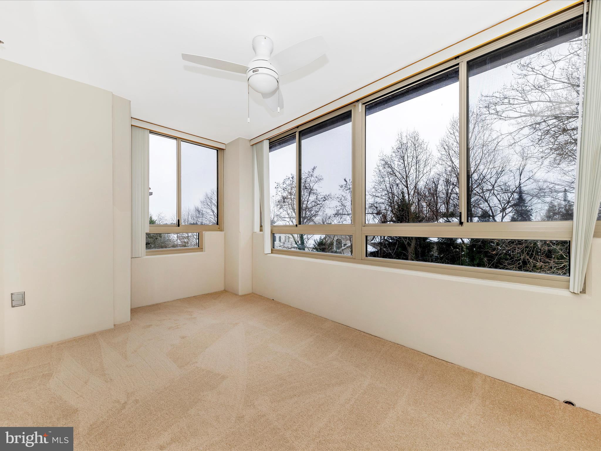 14809 Pennfield Circle, Unit 402 Silver Spring, MD 20906 - Photo 21 of 59 a view of an empty room with a window