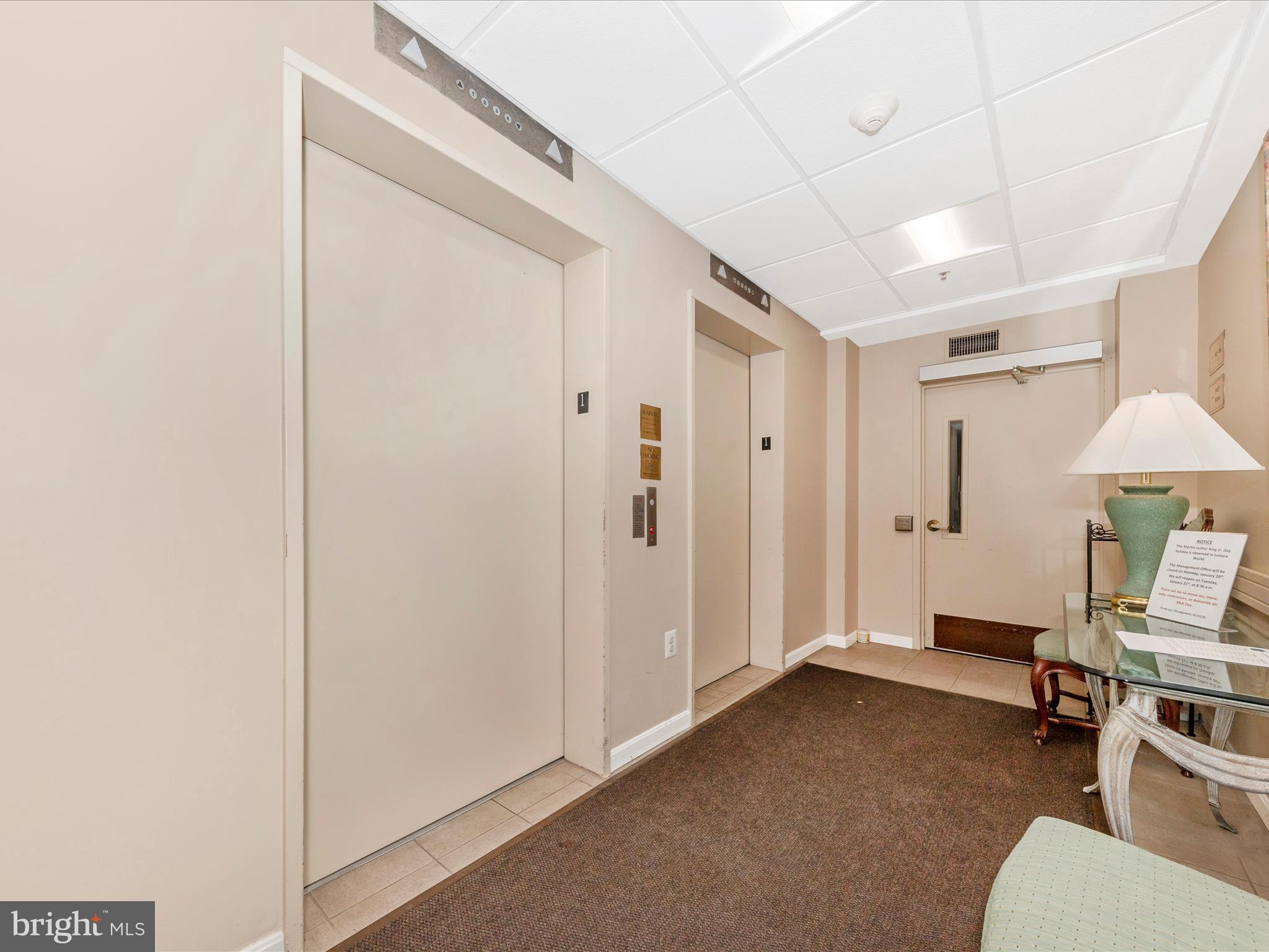 14809 Pennfield Circle, Unit 402 Silver Spring, MD 20906 - Photo 25 of 59 Garage elevators with parking spot 15 outside.