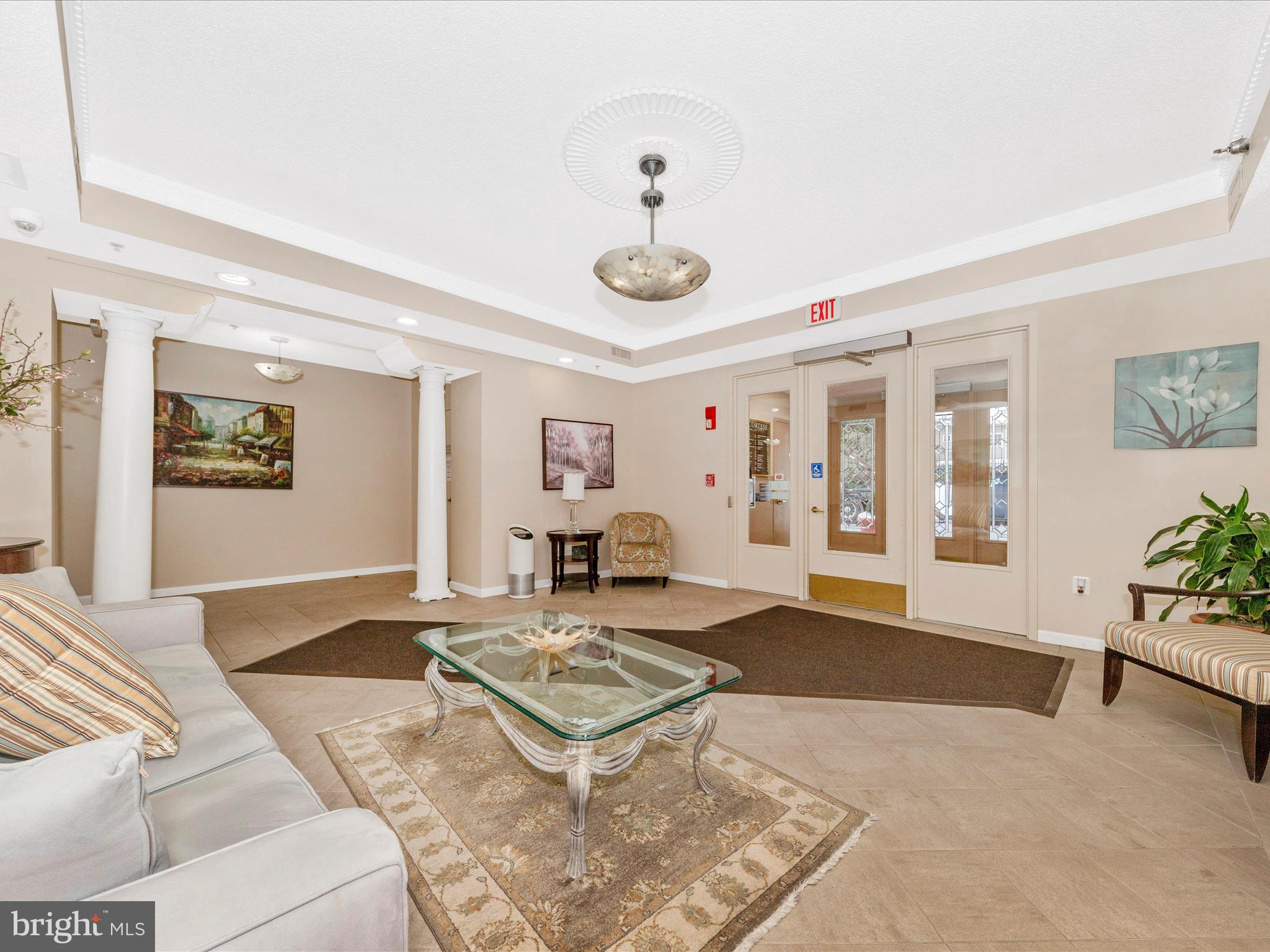 14809 Pennfield Circle, Unit 402 Silver Spring, MD 20906 - Photo 27 of 59 a living room with furniture and a table