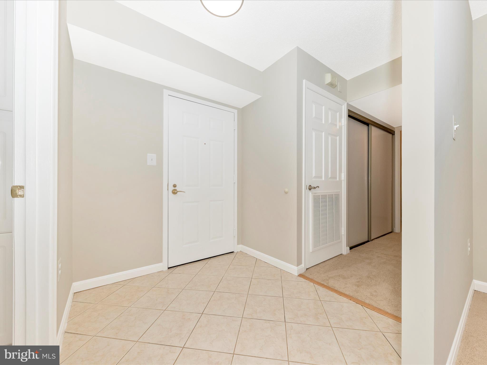 14809 Pennfield Circle, Unit 402 Silver Spring, MD 20906 - Photo 3 of 59 Enter into the foyer.