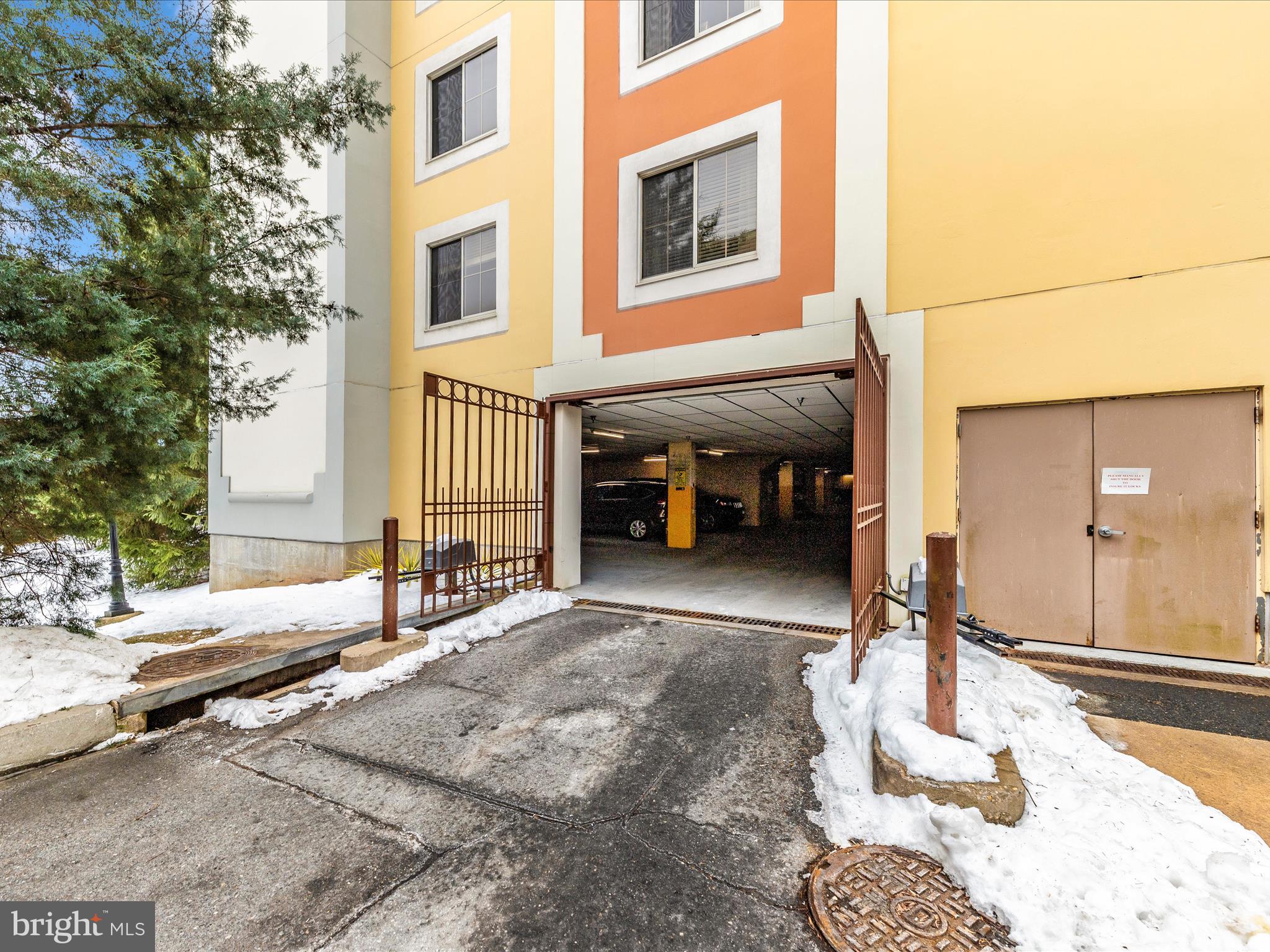 14809 Pennfield Circle, Unit 402 Silver Spring, MD 20906 - Photo 31 of 59 a view of a building with a lounge chairs in patio