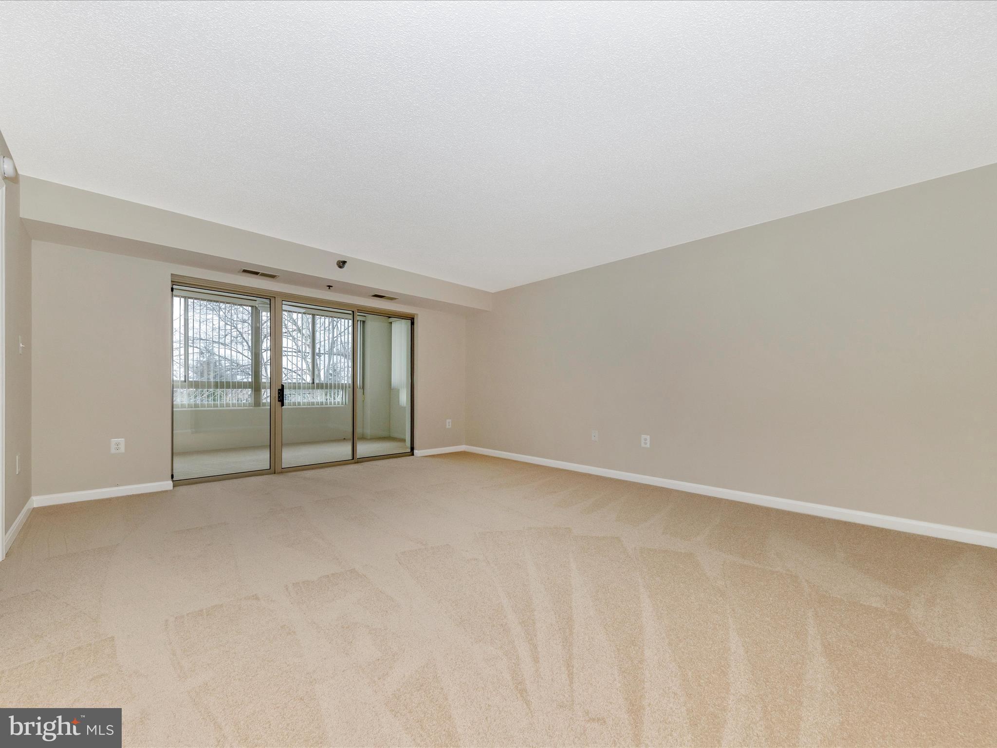 14809 Pennfield Circle, Unit 402 Silver Spring, MD 20906 - Photo 4 of 59 an empty room with windows