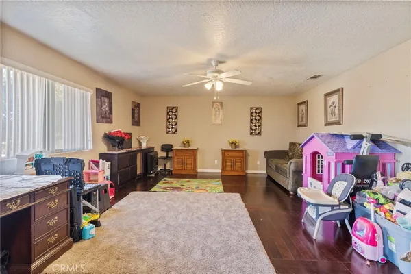 a bedroom with furniture and a chandelier