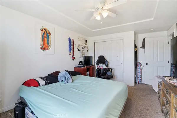 a living room with furniture and a dresser