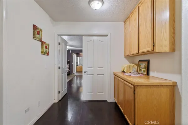 a bathroom with a sink a toilet and shower curtain