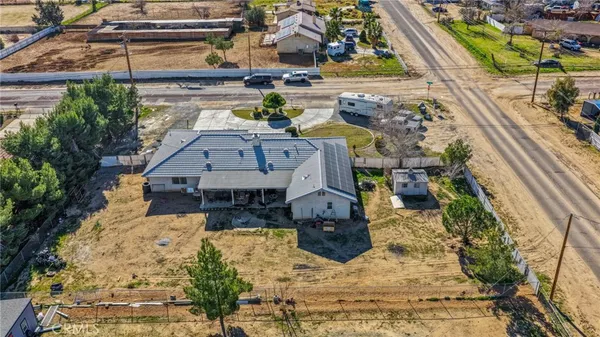 an aerial view of residential houses and outdoor space