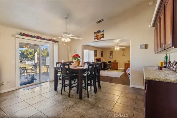 a view of a dining room with furniture window and outdoor kitchen