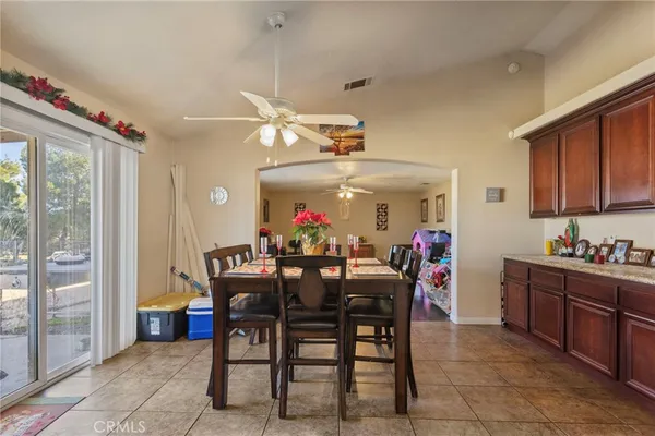 a view of a dining room and livingroom furniture wooden floor and a chandelier