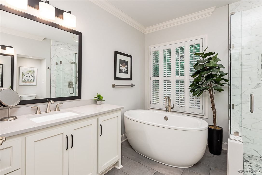 113 Grenelefe Williamsburg, VA 23188 - Photo 22 of 44 a bathroom with a bathtub a sink and a window