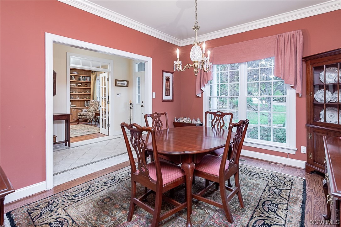 113 Grenelefe Williamsburg, VA 23188 - Photo 9 of 44 a view of a dining room with furniture window and wooden floor