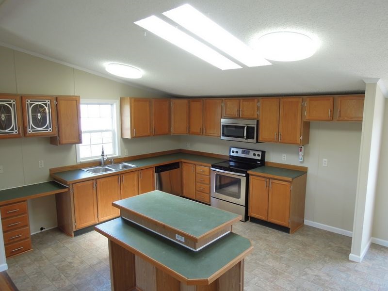 781 Concord Church Road Timberville, VA 22853 - Photo 4 of 18 a kitchen with stainless steel appliances granite countertop a sink stove and microwave