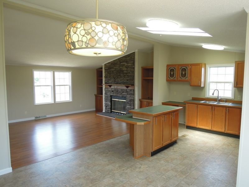 781 Concord Church Road Timberville, VA 22853 - Photo 5 of 18 a kitchen with stainless steel appliances granite countertop a stove and a sink