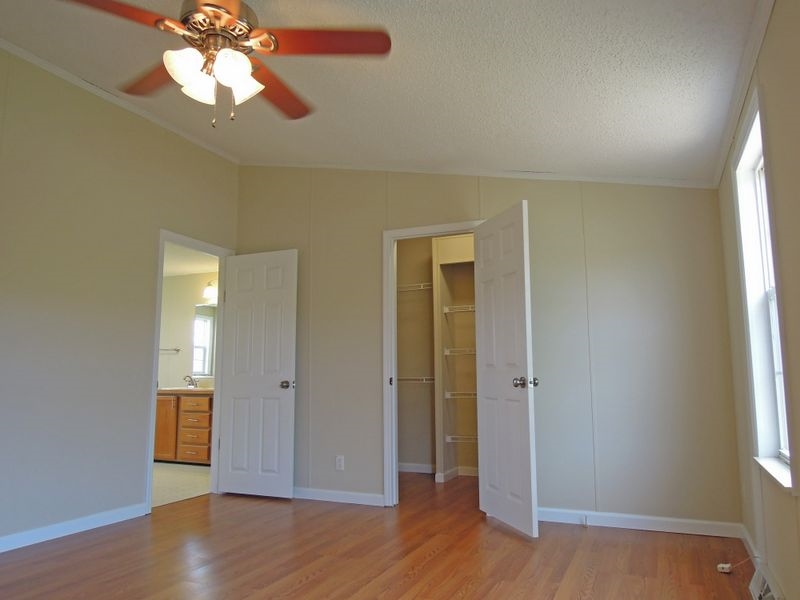 781 Concord Church Road Timberville, VA 22853 - Photo 8 of 18 an empty room with wooden floor and windows