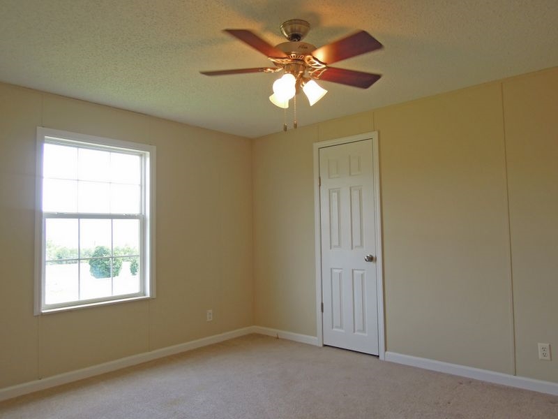 781 Concord Church Road Timberville, VA 22853 - Photo 10 of 18 an empty room with windows and fan