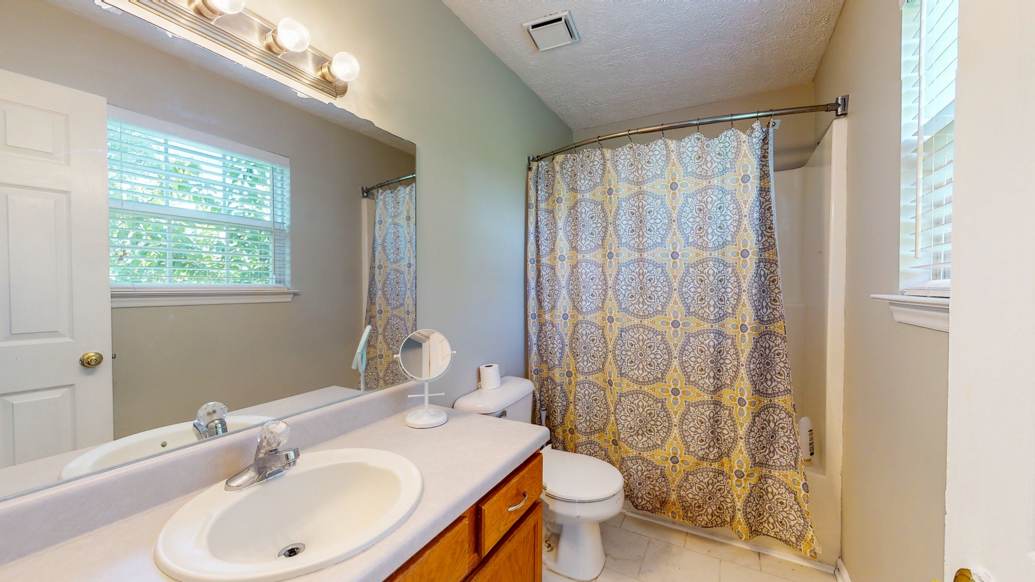 3718 Maple Lane Murfreesboro, TN 37129 - Photo 12 of 30 a bathroom with a sink toilet and shower