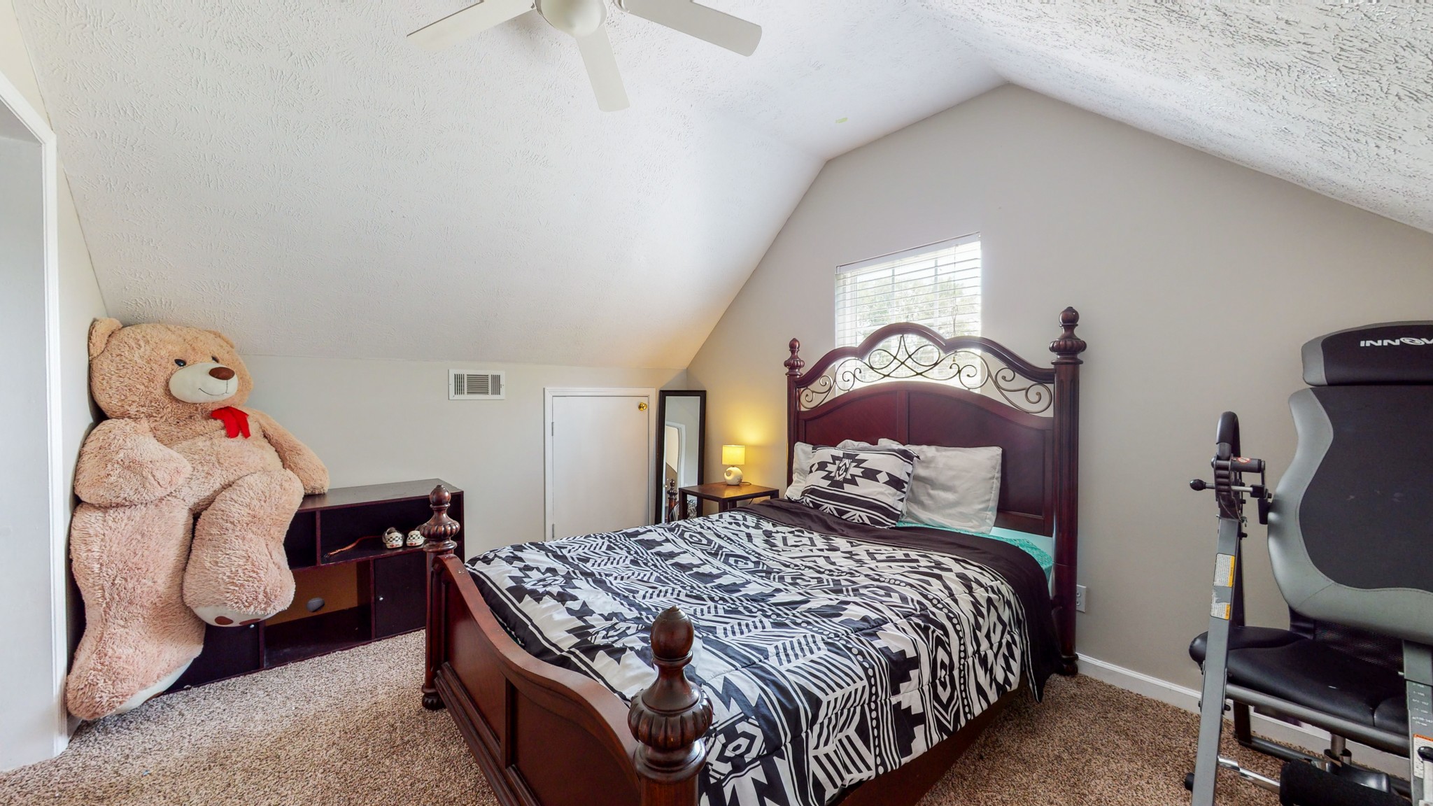 3718 Maple Lane Murfreesboro, TN 37129 - Photo 18 of 30 a bedroom with a bed and dresser with wooden floor