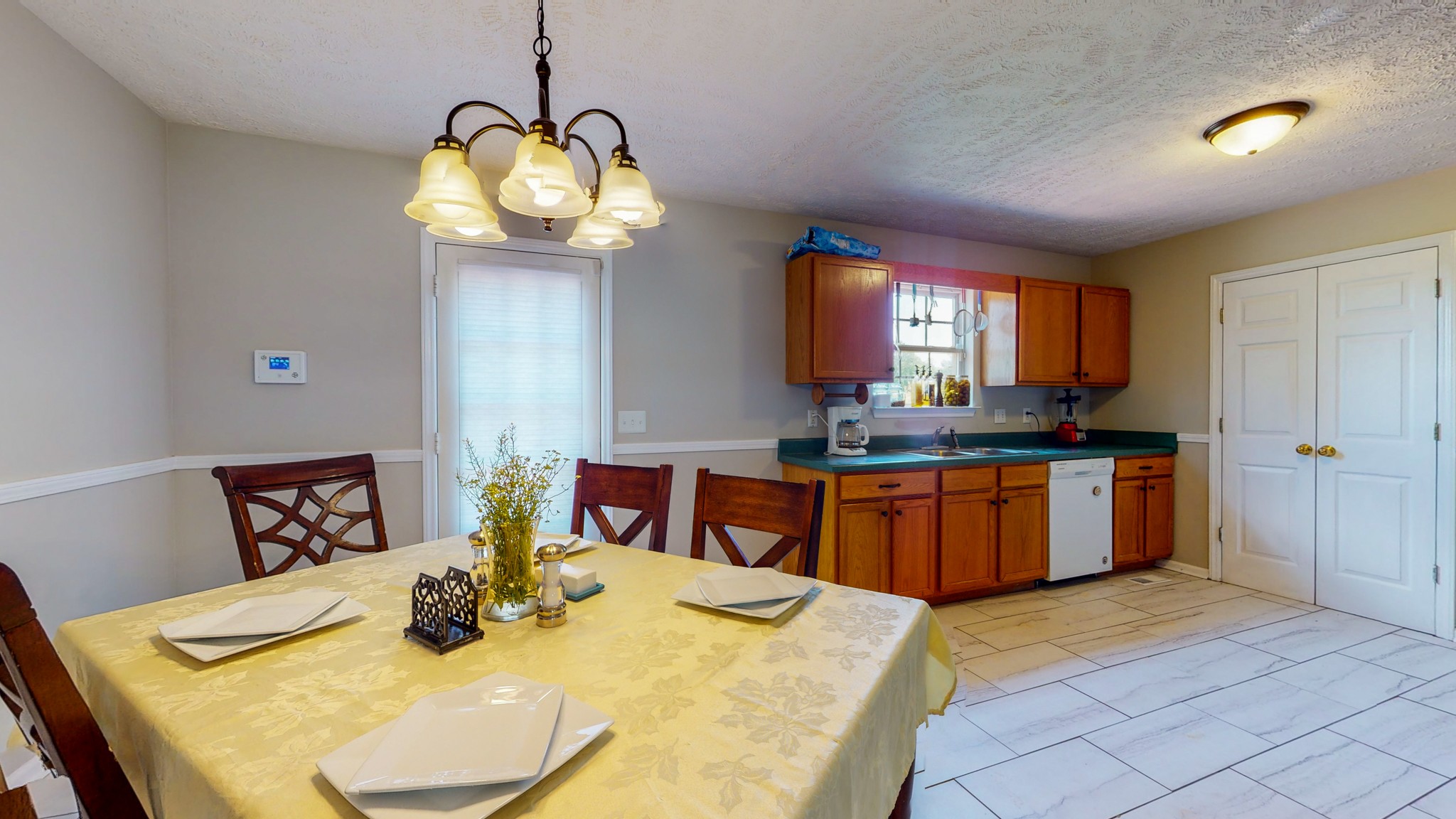 3718 Maple Lane Murfreesboro, TN 37129 - Photo 6 of 30 a kitchen with kitchen island granite countertop a sink a stove top oven a dining table and chairs