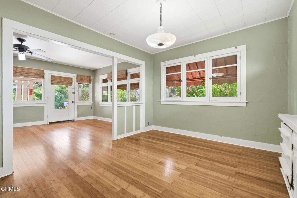 233 Ohio Street Pasadena, CA 91106 - Photo 12 of 22 a view of an empty room with wooden floor and a window