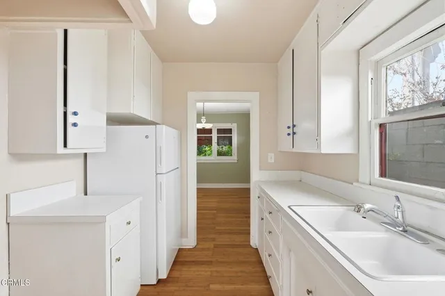 a bathroom with a sink a mirror and a shower