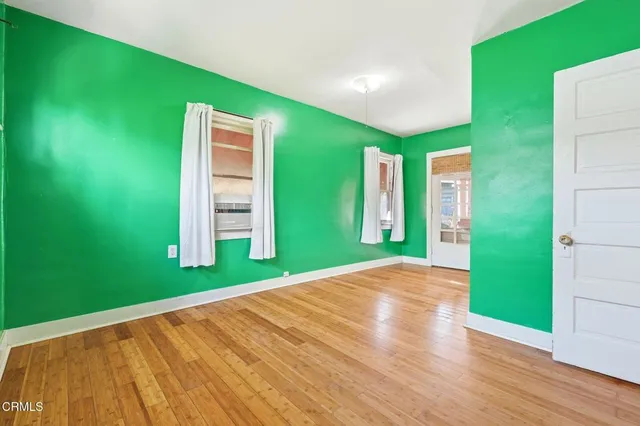 a view of outdoor space with wooden floor and windows