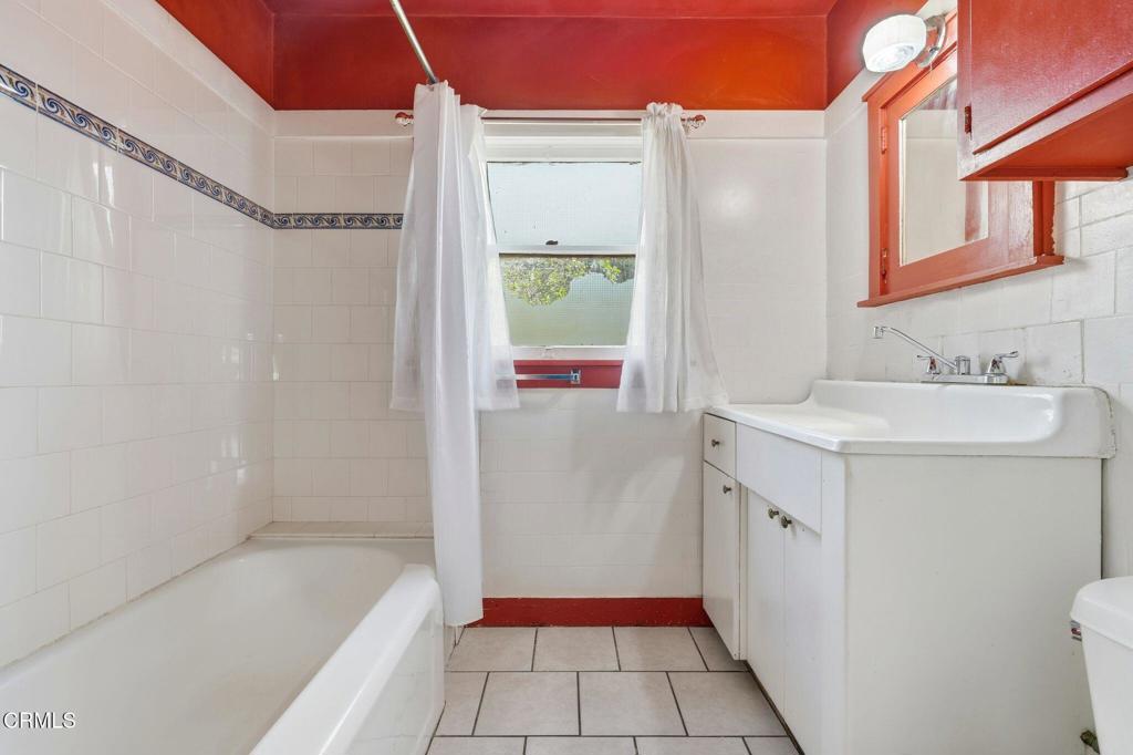 233 Ohio Street Pasadena, CA 91106 - Photo 21 of 22 a bathroom with a sink a toilet and shower