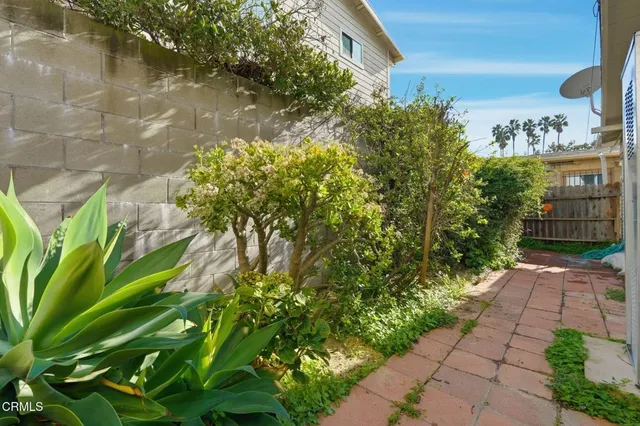 a backyard of a house with a garden