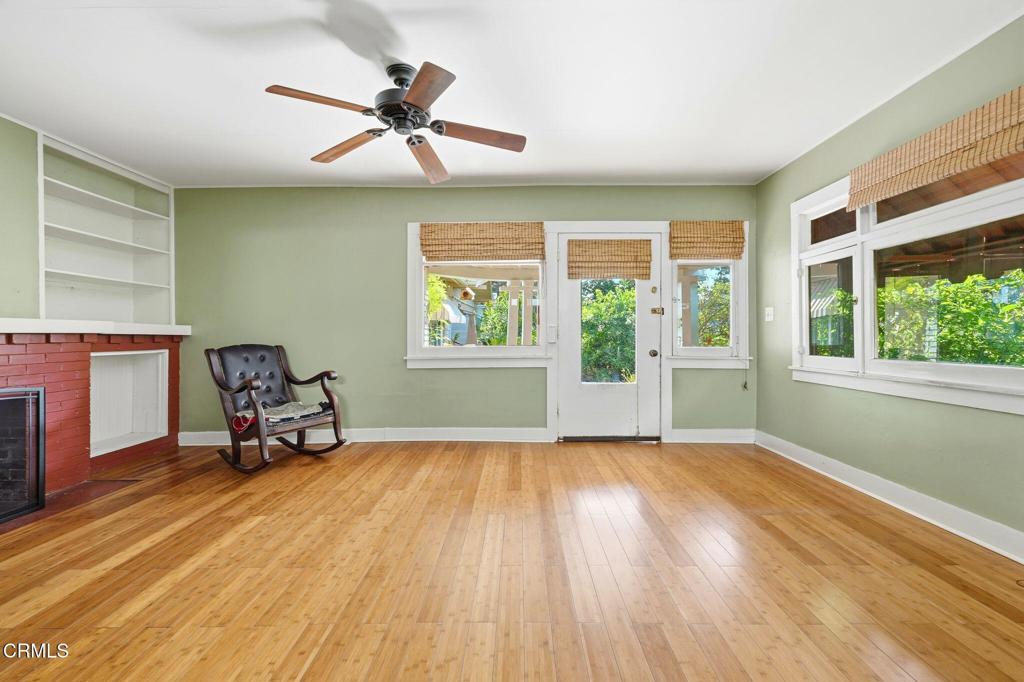 233 Ohio Street Pasadena, CA 91106 - Photo 7 of 22 a view of an empty room with a window and wooden floor