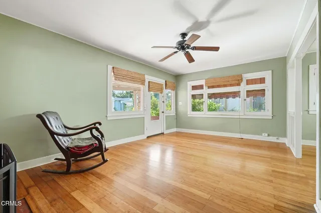 a view of a room with furniture window and wooden floor