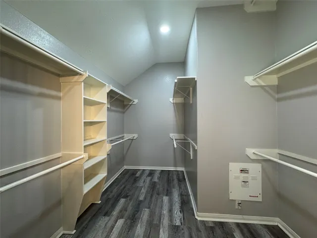 a view of storage and utility room with empty racks