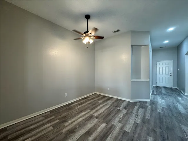 a view of room with window and ceiling fan