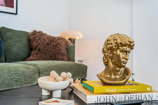 a view of a house with a yard and many windows