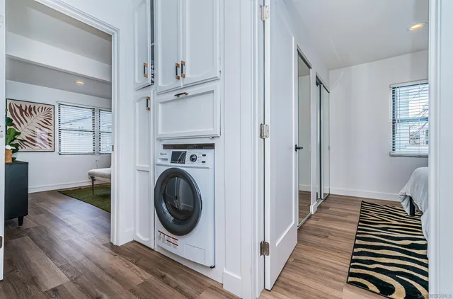 a view of a hallway with washer and dryer