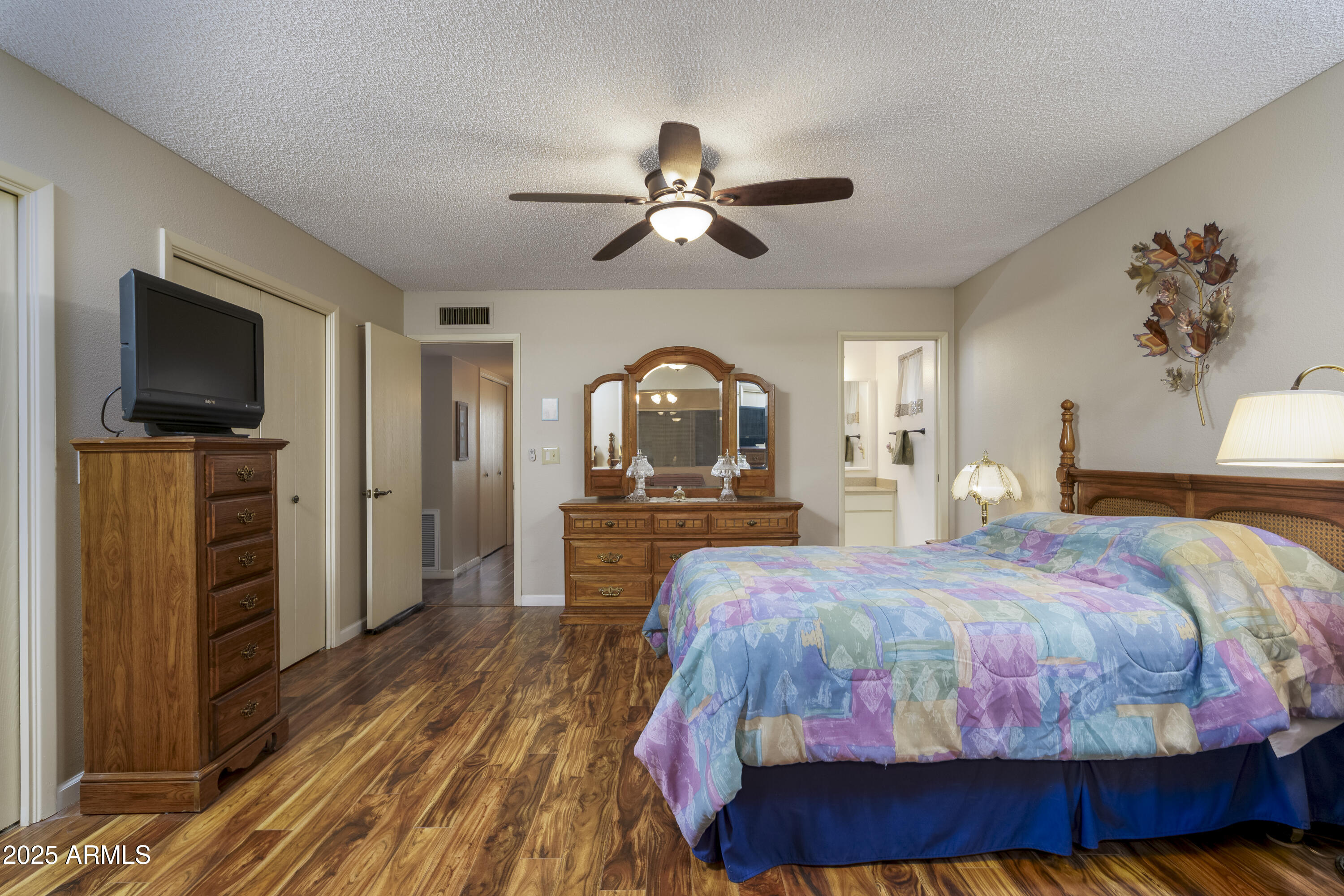 518 South Racine Mesa, AZ 85206 - Photo 14 of 24 a bedroom with a bed and a flat screen tv