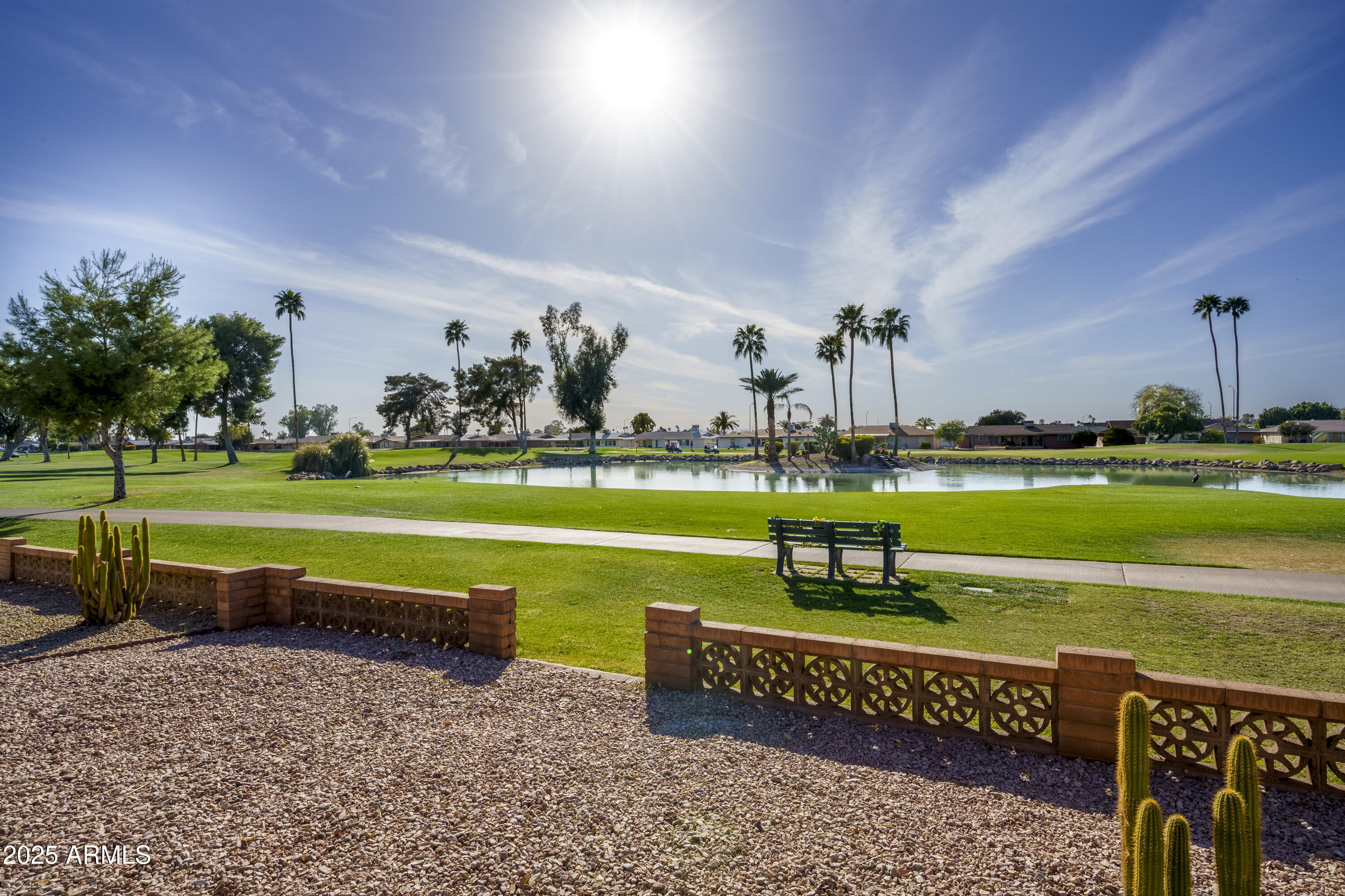 518 South Racine Mesa, AZ 85206 - Photo 22 of 24 a view of a swimming pool with lawn chairs and a big yard