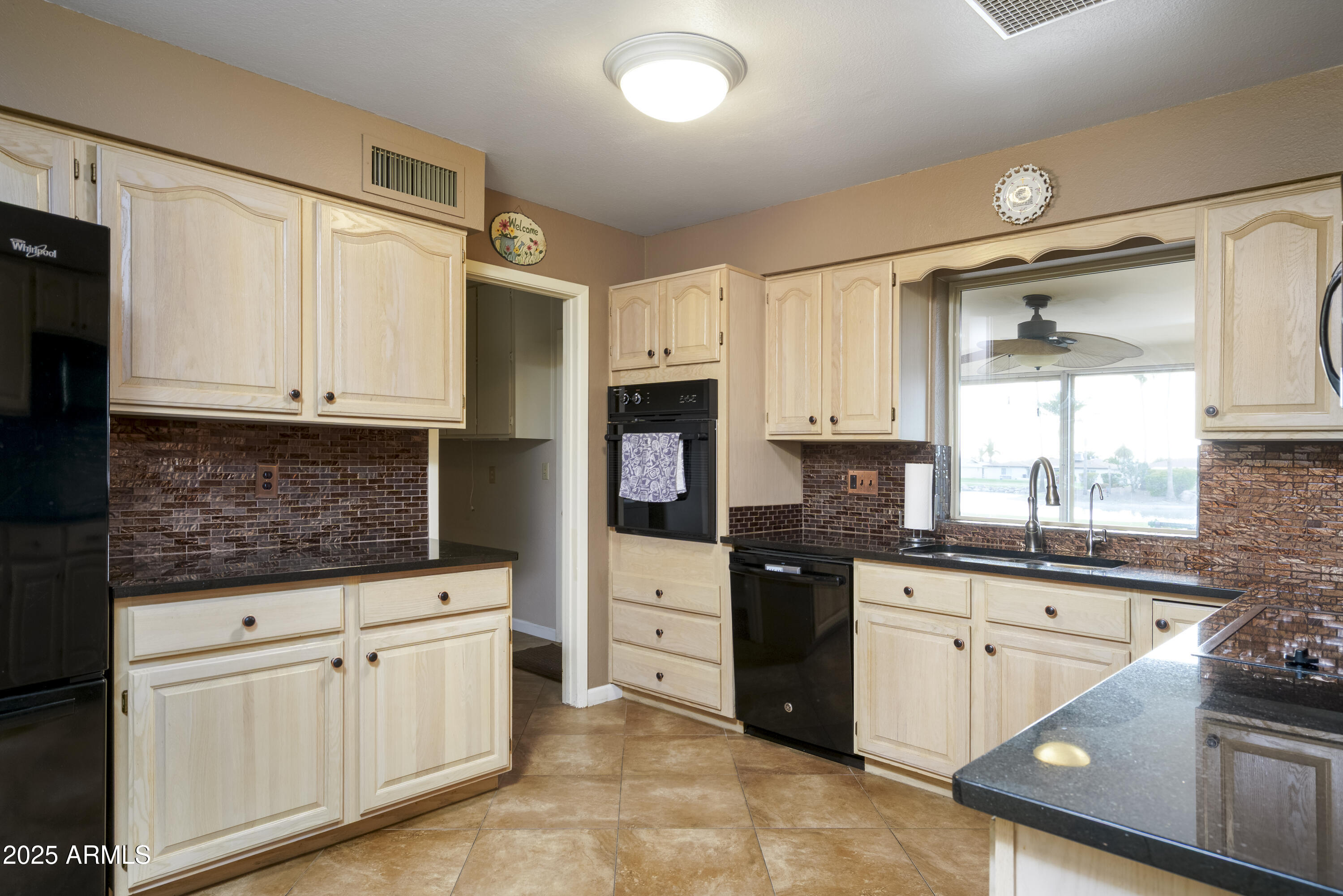 518 South Racine Mesa, AZ 85206 - Photo 7 of 24 a kitchen with granite countertop white cabinets and white appliances