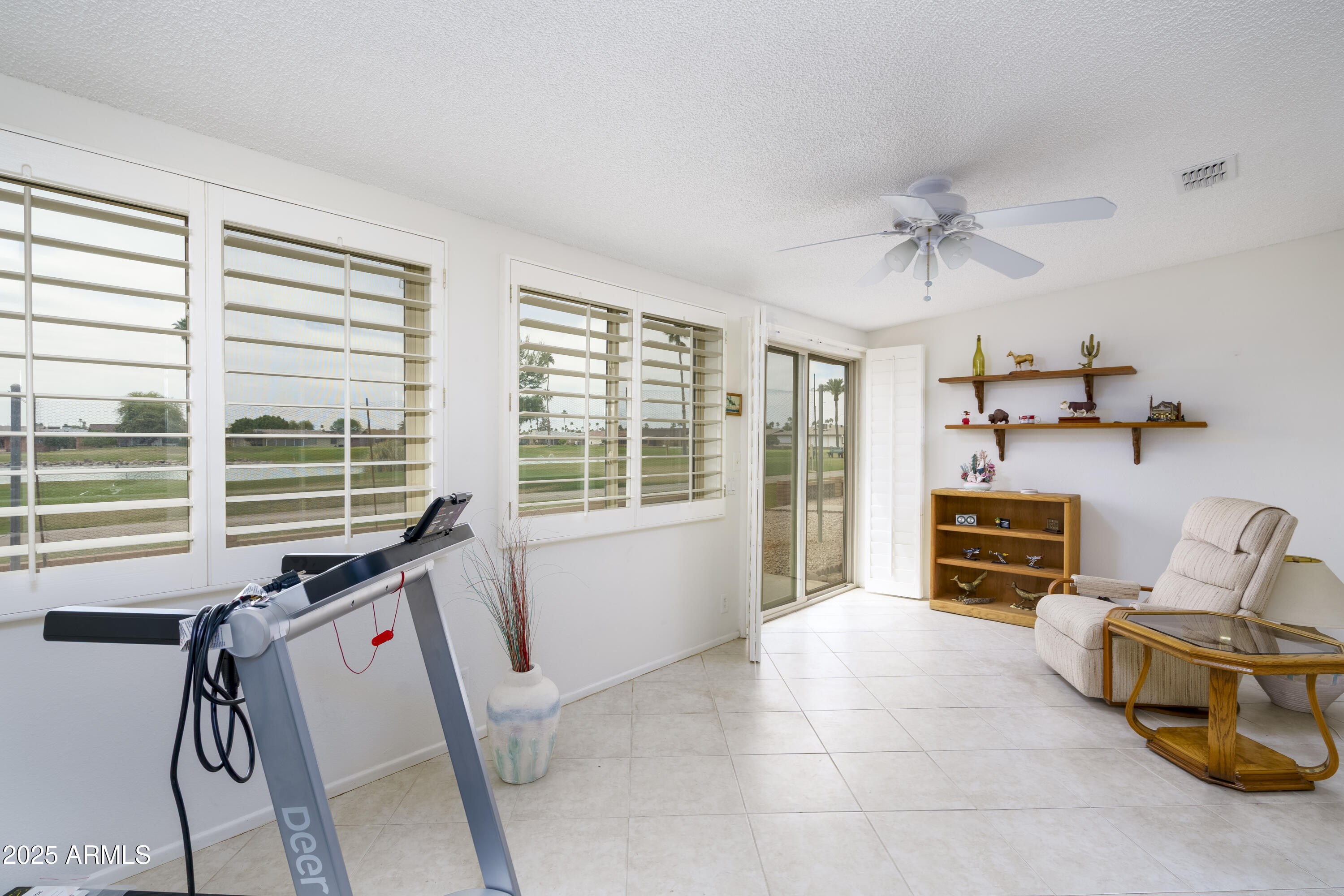 518 South Racine Mesa, AZ 85206 - Photo 9 of 24 a living room with furniture and a flat screen tv