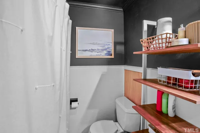 a reading room with furniture and book shelf