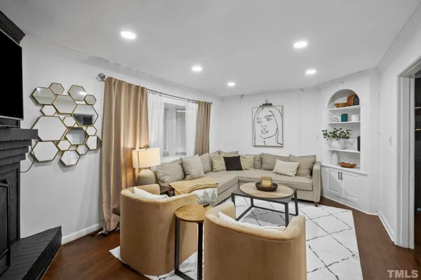 a living room with furniture and a window
